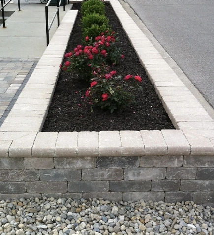 Landscape design with planting bed and hardscape